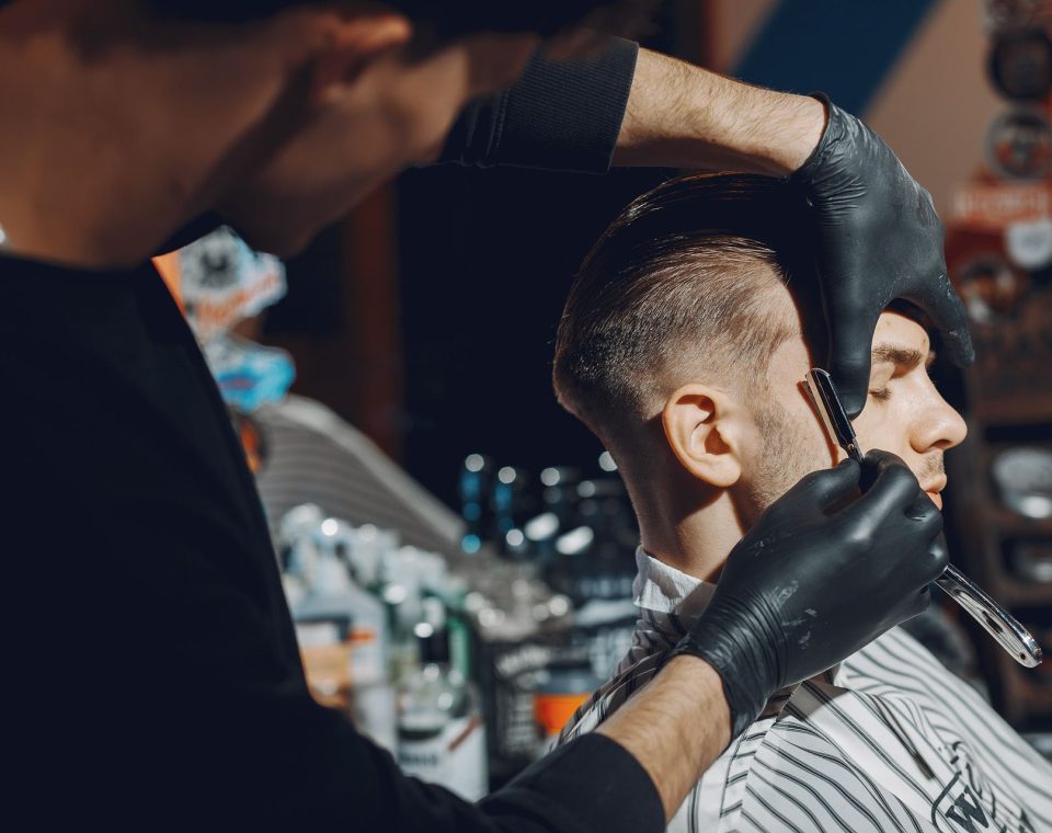 stylish-man-sitting-in-a-barbershop-EYR3SFA.jpg